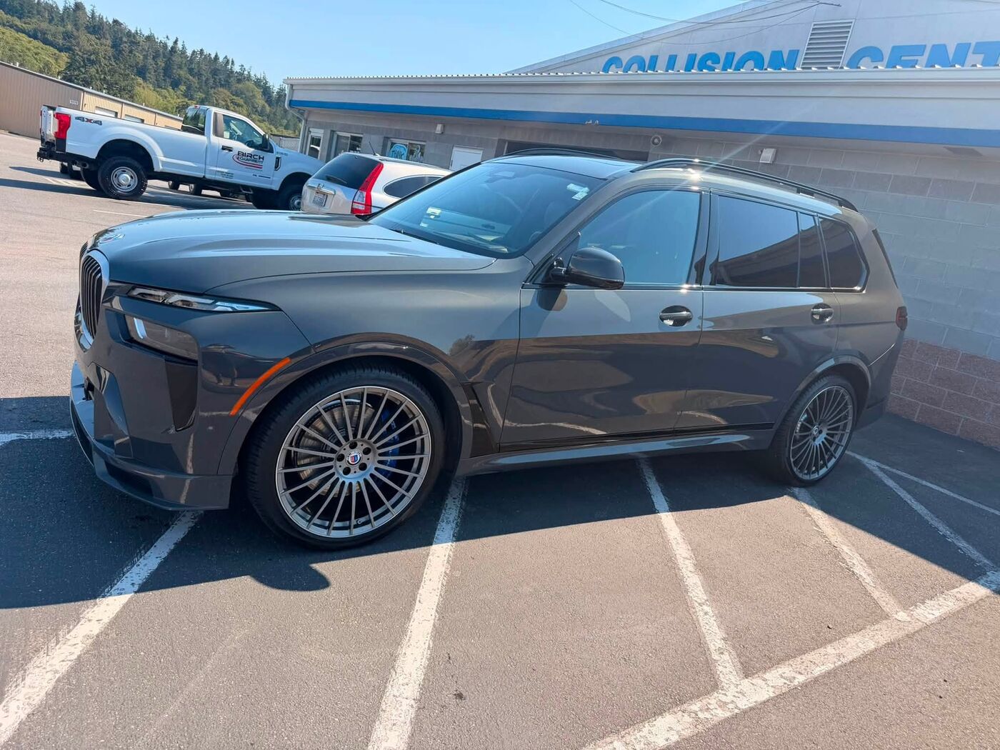 Side view of the grey BMW Alpina SUV after its detail