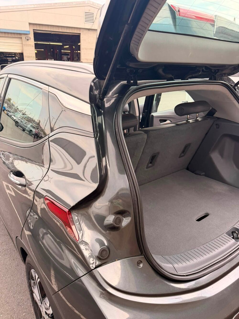 The same hatch and cargo area after detailing, jambs wiped clean and carpet vacuumed